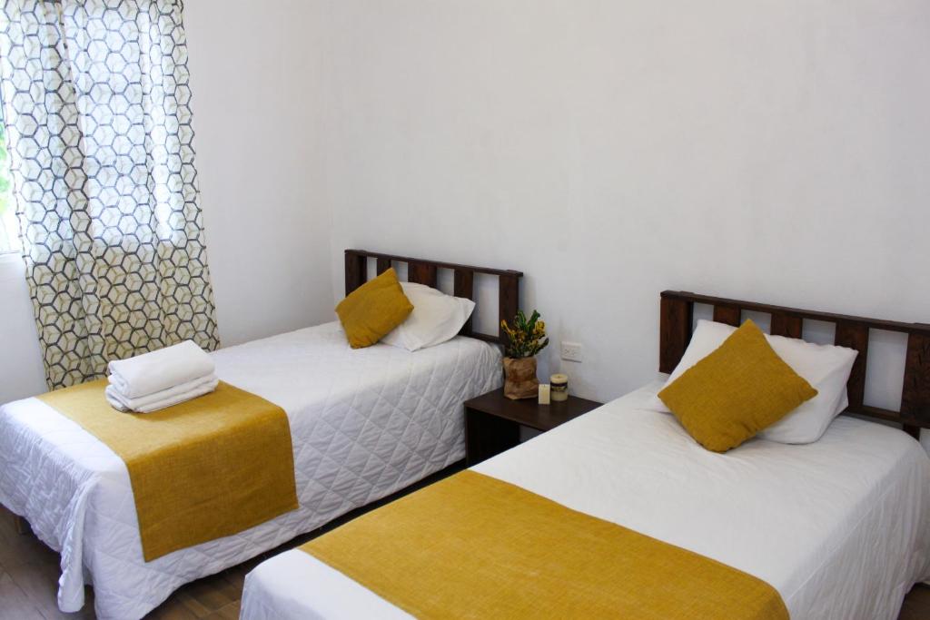 Rooms in Cancun Airport客房内的一张或多张床位