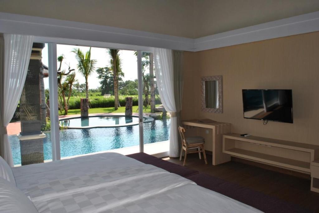 Room in Villa - Kori Maharani Villas - Suite Lagoon 3内部或周边的泳池