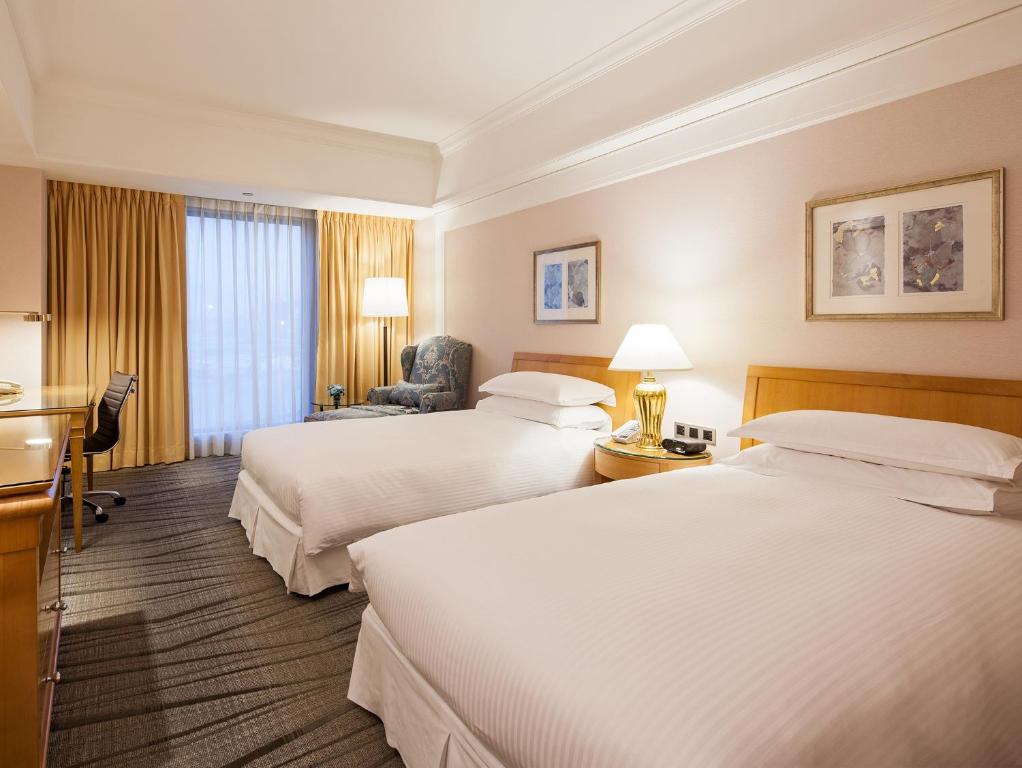 珑山林台北中和饭店客房内的一张或多张床位