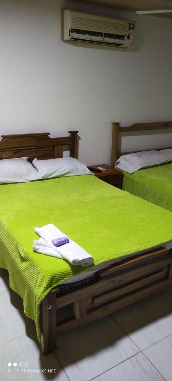 Hotel Brisas Del Magdalena客房内的一张或多张床位