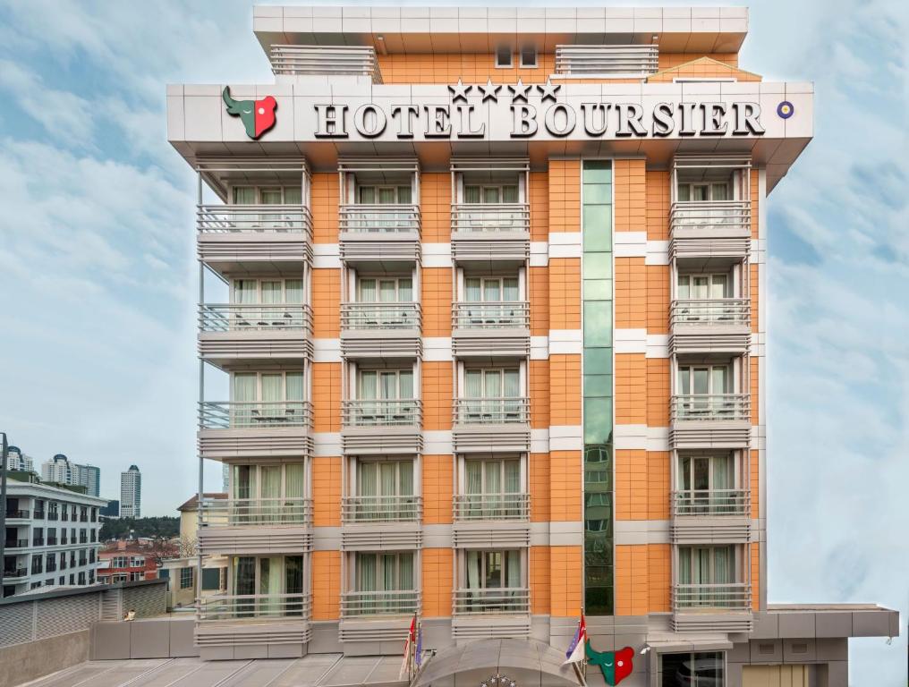 伊斯坦布尔Hotel Boursier 2 & Spa的上面标有标志的酒店大楼