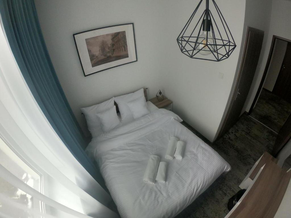 Stary Koszalin Hostel &amp; Hotel Services客房内的一张或多张床位