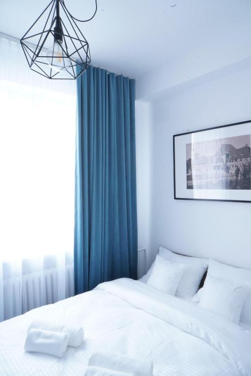 Stary Koszalin Hostel &amp; Hotel Services客房内的一张或多张床位