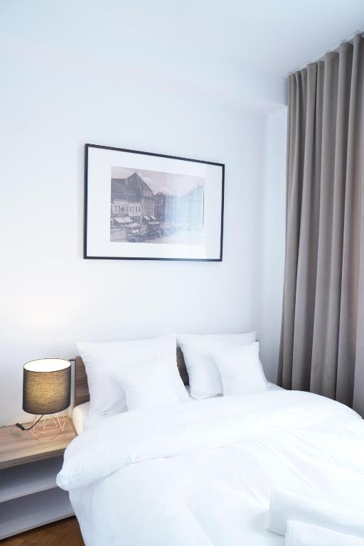 Stary Koszalin Hostel &amp; Hotel Services客房内的一张或多张床位