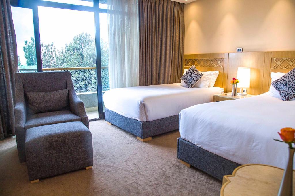 Vamos Addis Hotel客房内的一张或多张床位