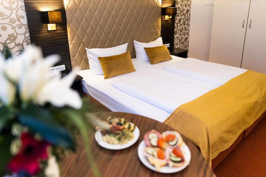 莱比锡皇家国际酒店客房内的一张或多张床位