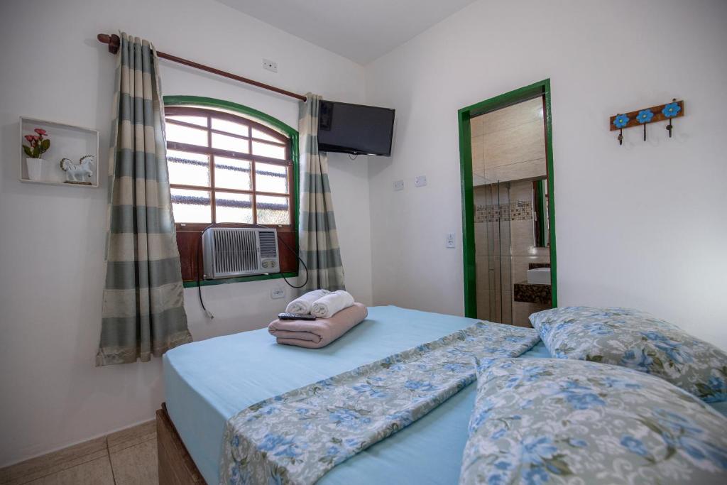 Pousada Casa do Rio Hostel - 8 min do Centro Hístorico - Passeio de Barco com saída da Pousada -Pago a parte- Perto das Praias e Beira Rio客房内的一张或多张床位