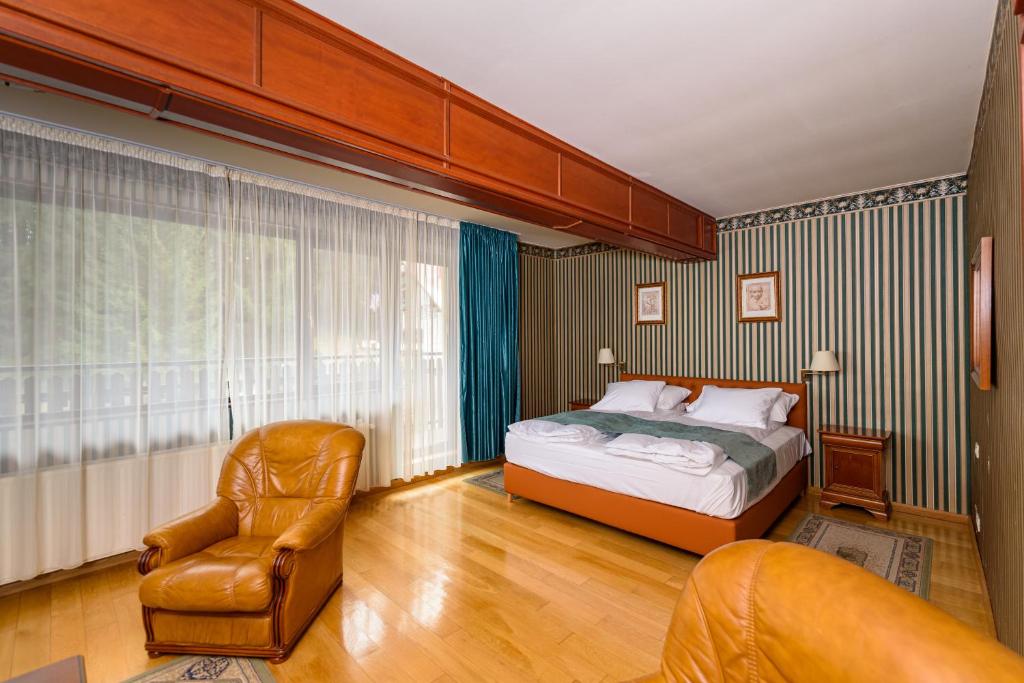 埃米尔卡萨精品酒店客房内的一张或多张床位