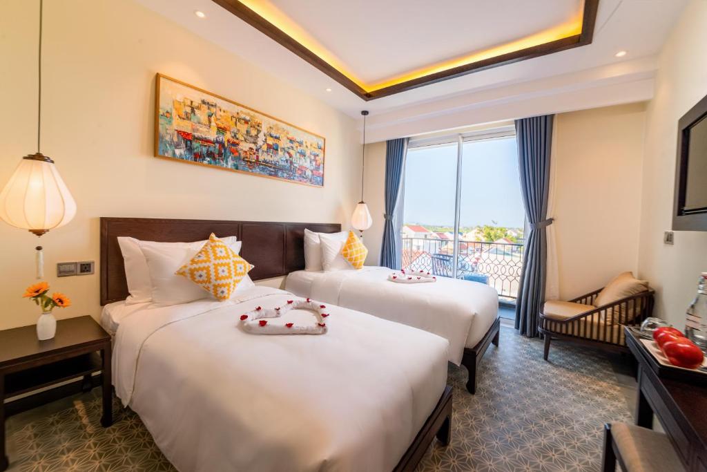 Hoi An Merrily De Art Hotel客房内的一张或多张床位