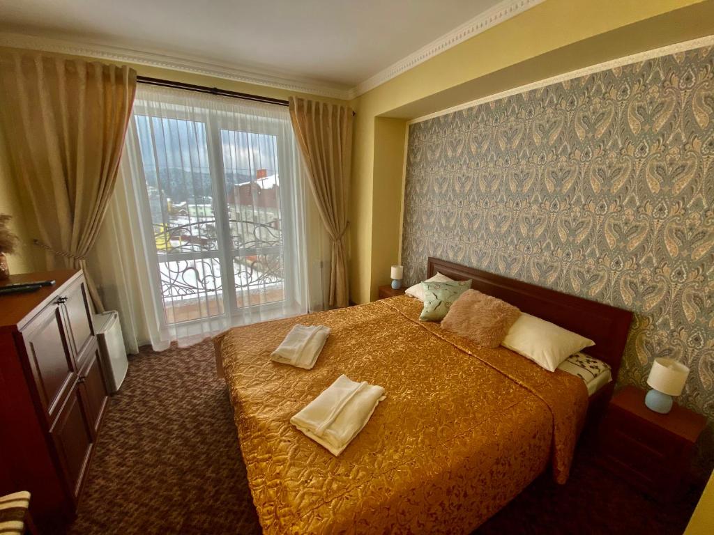 Hotel Three Korony客房内的一张或多张床位