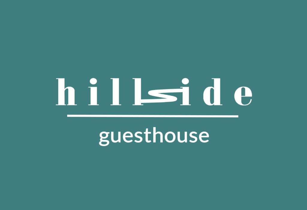 奥拉迪亚Hillside的一间旅馆内读到的标志