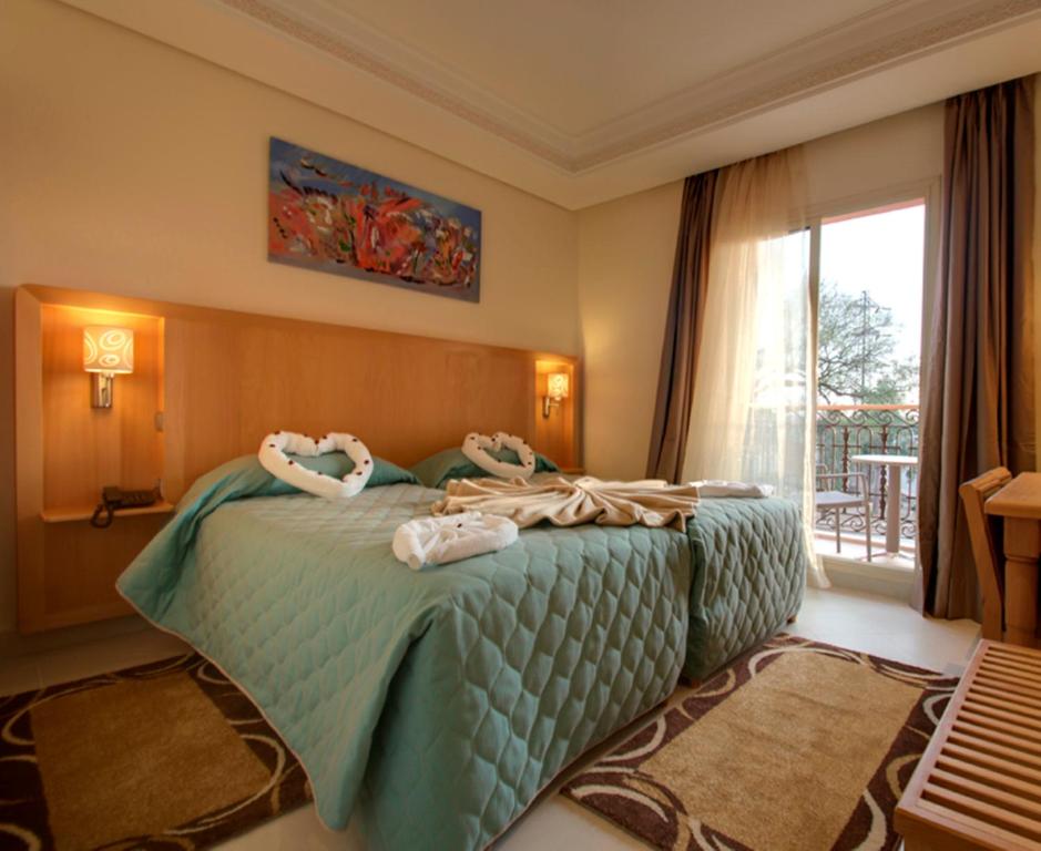 阿尔巴亚宫殿酒店客房内的一张或多张床位