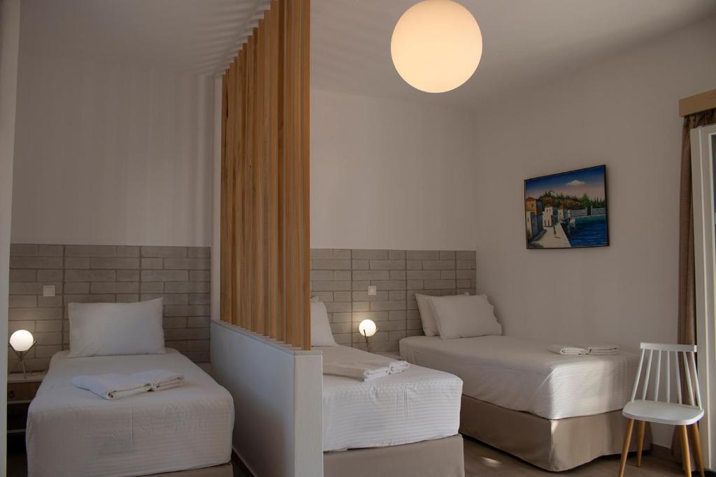AGNADEMA Luxury Residences客房内的一张或多张床位