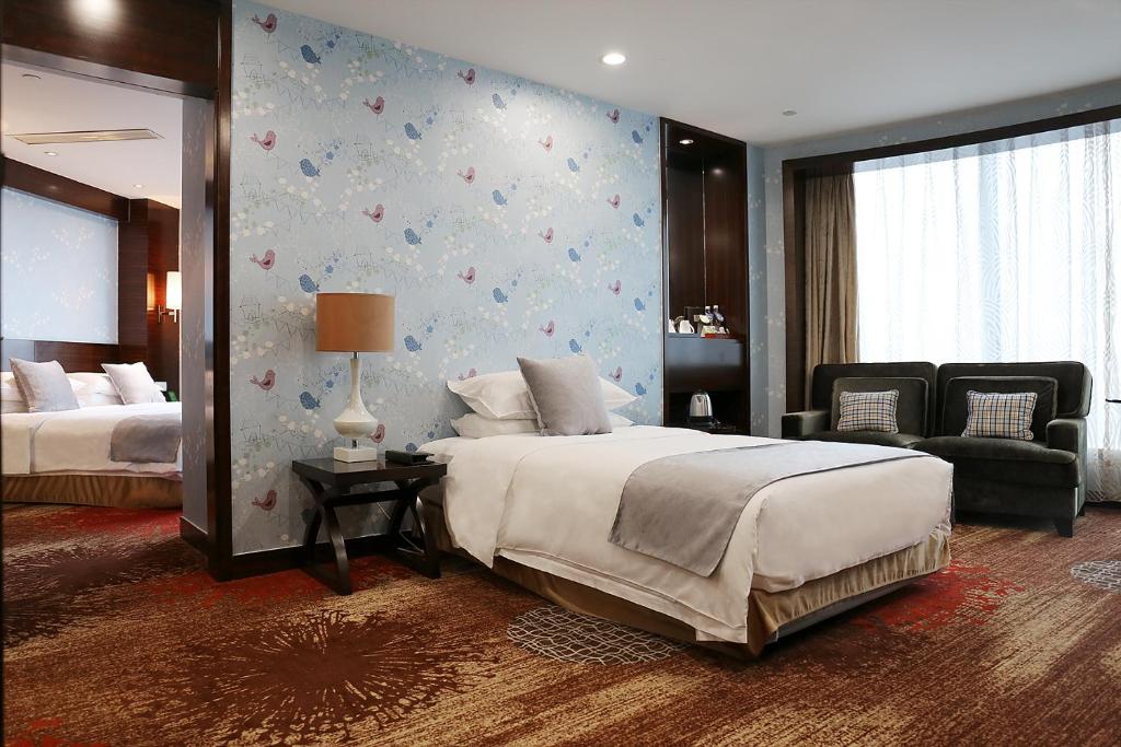 芜湖新百金陵大酒店客房内的一张或多张床位