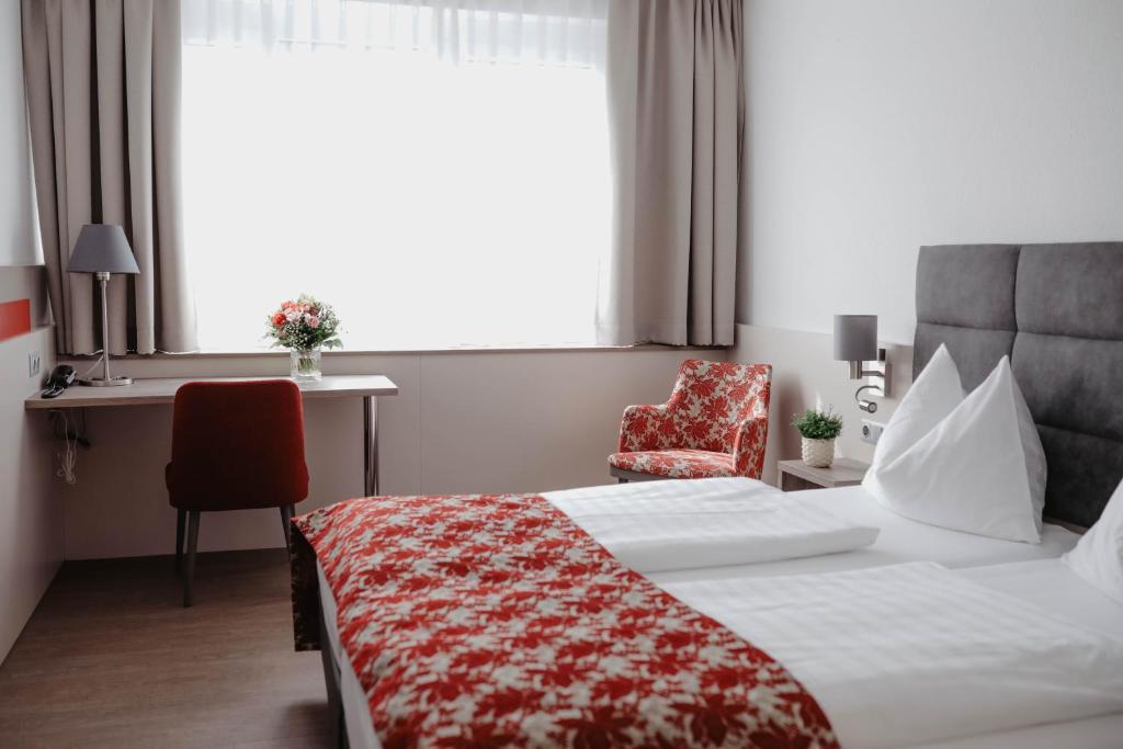 Stadtoase Kolping Hotel客房内的一张或多张床位