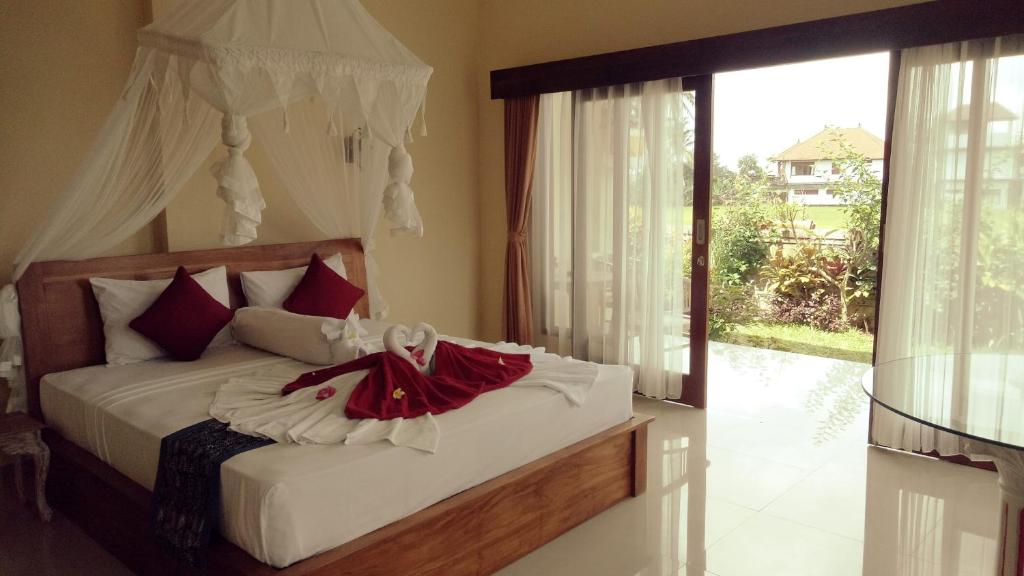 Beras Bali Suite客房内的一张或多张床位