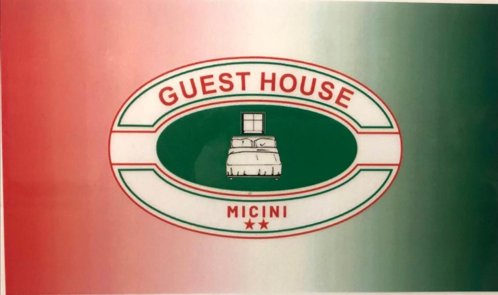 德鲁恩托Guest House MICINI的贴上灯塔的旅馆标志
