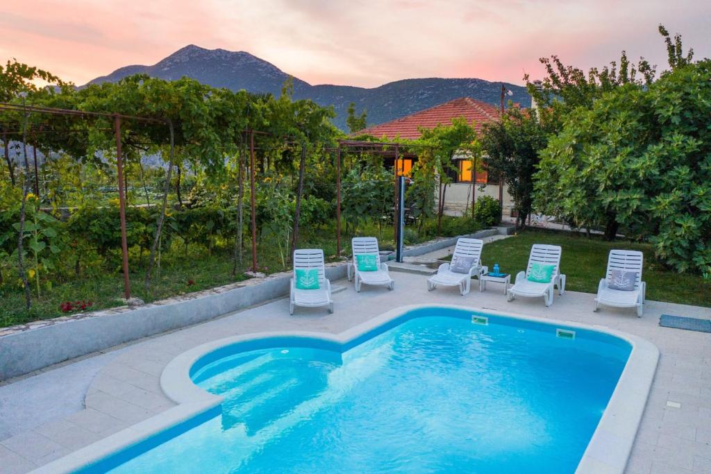 sunflower house with a pool and large garden