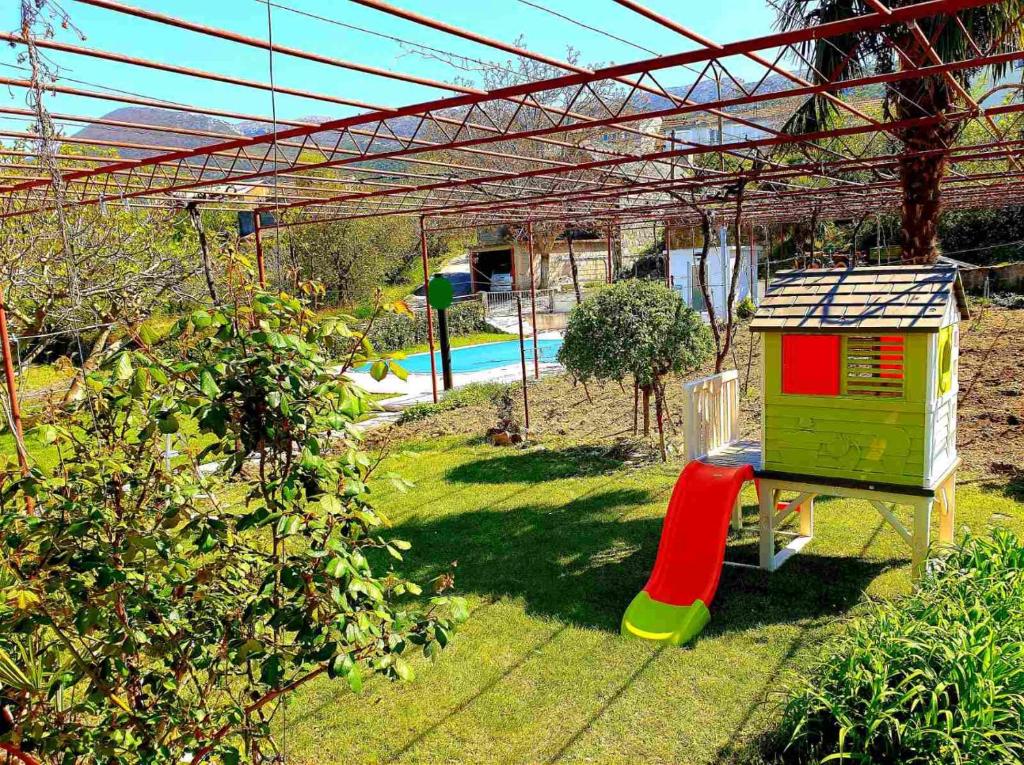 sunflower house with a pool and large garden