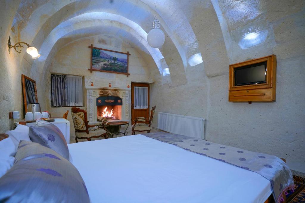 爱丽舍洞穴酒店客房内的一张或多张床位