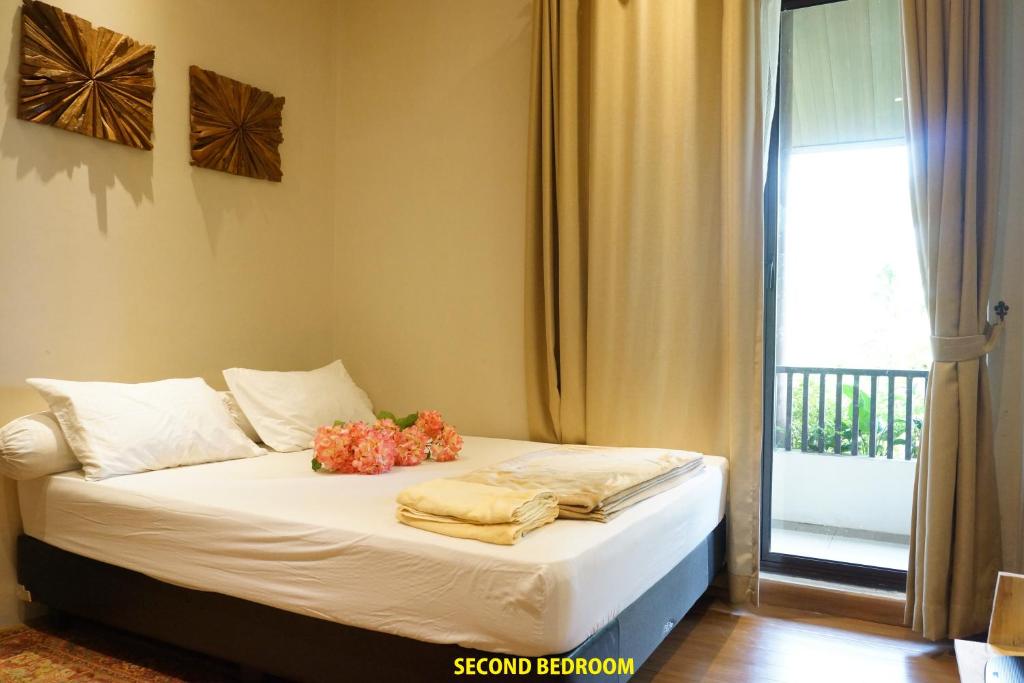 Vimala Hills Resort Cozy Villa Puncak Gadog Bogor客房内的一张或多张床位