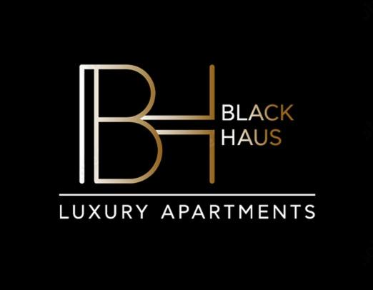 塞萨洛尼基BLACKHAUS Apartments的黑色和金色标志,带有字母b和豪华公寓