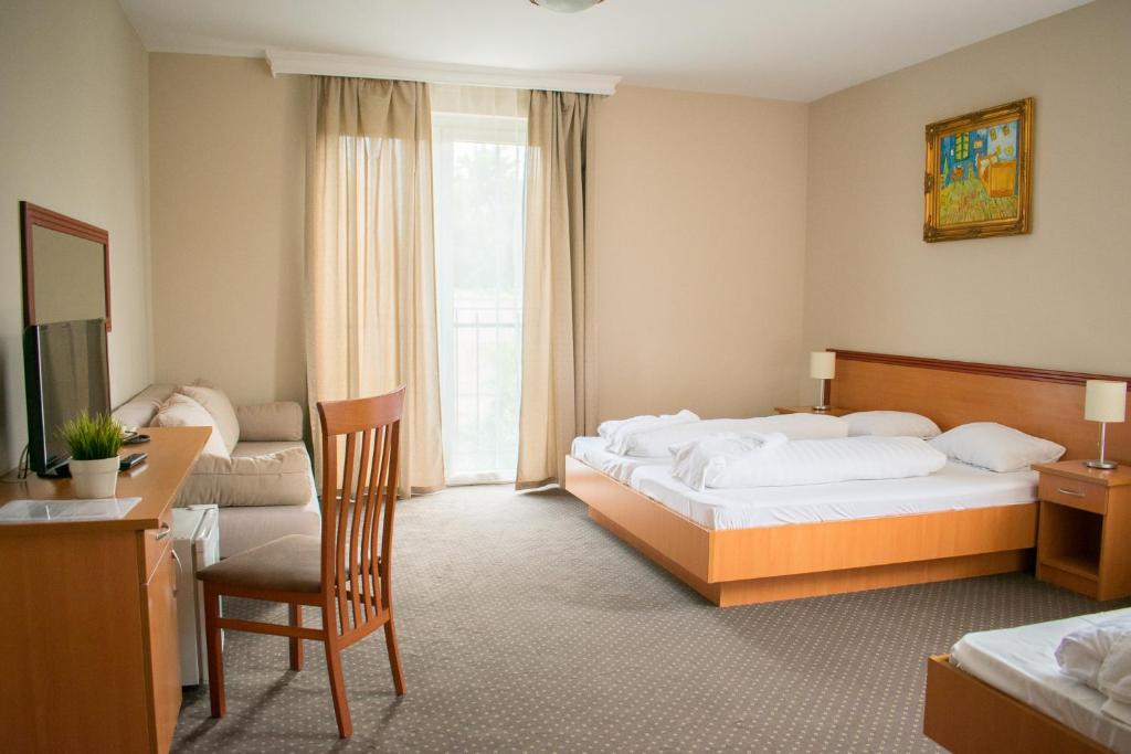 松博特海伊P4W酒店客房内的一张或多张床位