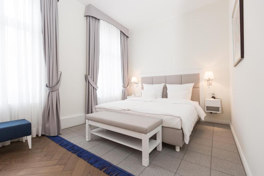 波茨坦勃兰登堡门酒店客房内的一张或多张床位