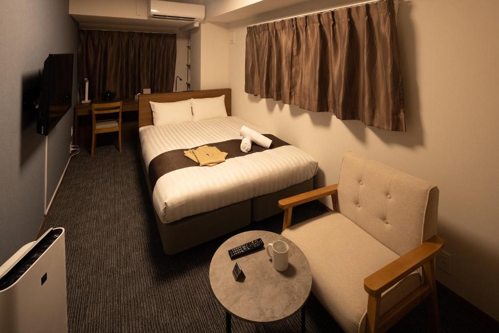 Coruscant Hotel NagasakiekiⅢ客房内的一张或多张床位