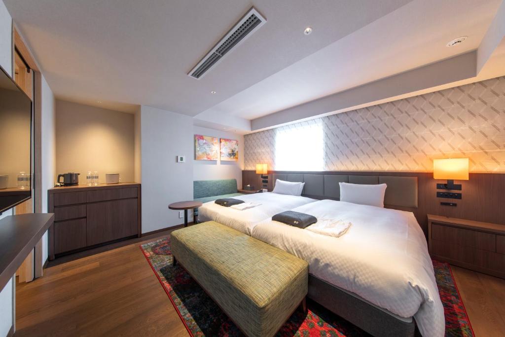 Hotel Forza Nagoya Sakae客房内的一张或多张床位