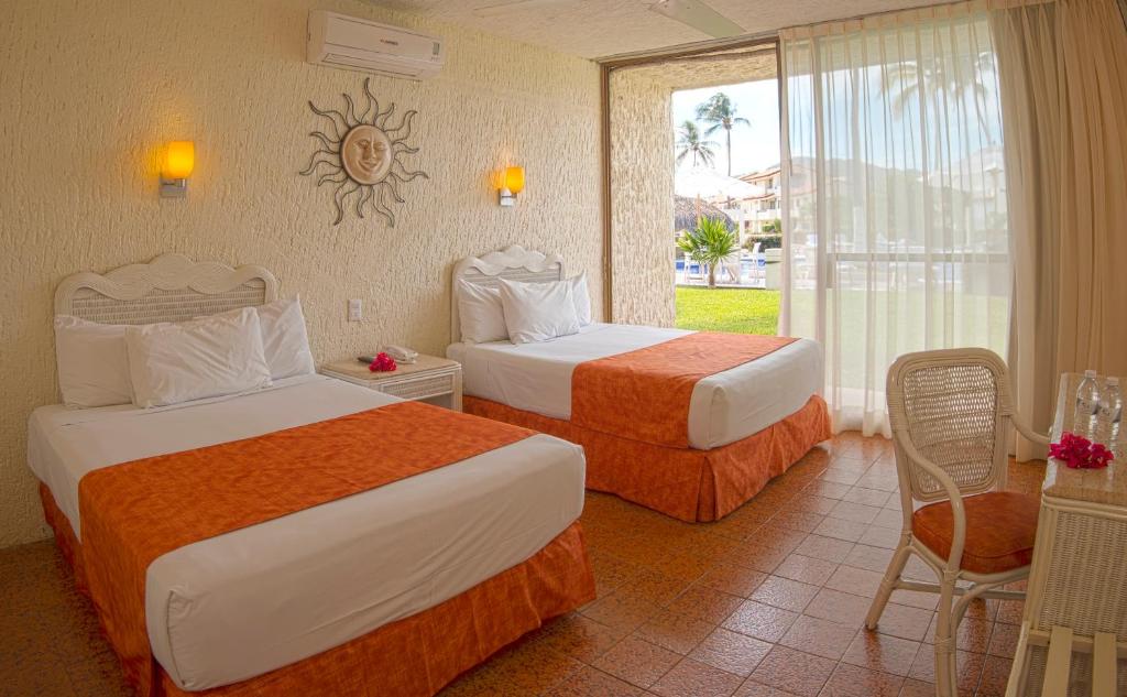 Cabo Blanco Hotel and Marina客房内的一张或多张床位
