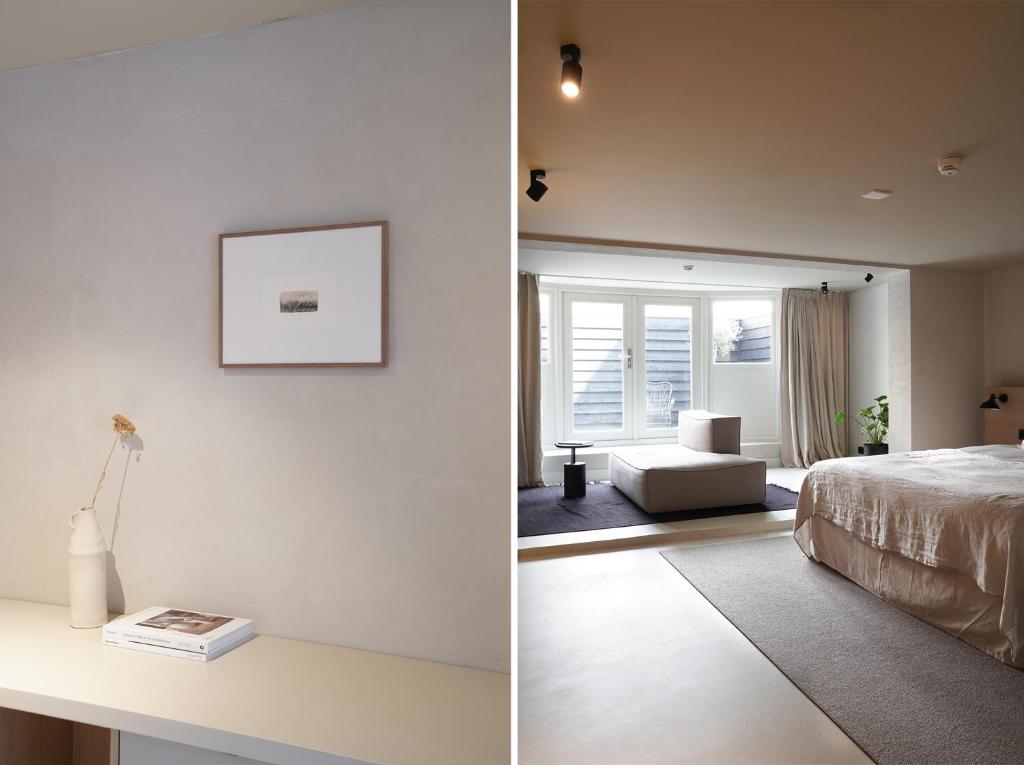 鹿特丹Hotel âme的一间卧室设有一张床和一间客厅。