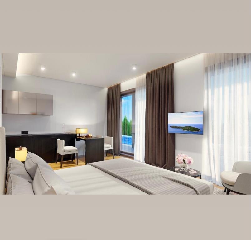 比尔迦Sea Breeze White Villas的一间卧室设有一张床和一间客厅。