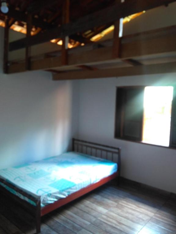Casa de temporada Lindas Cachoeiras 10客房内的一张或多张床位