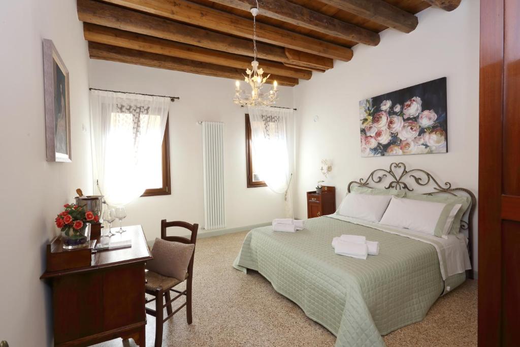 Ca' del Pittor Apartments客房内的一张或多张床位