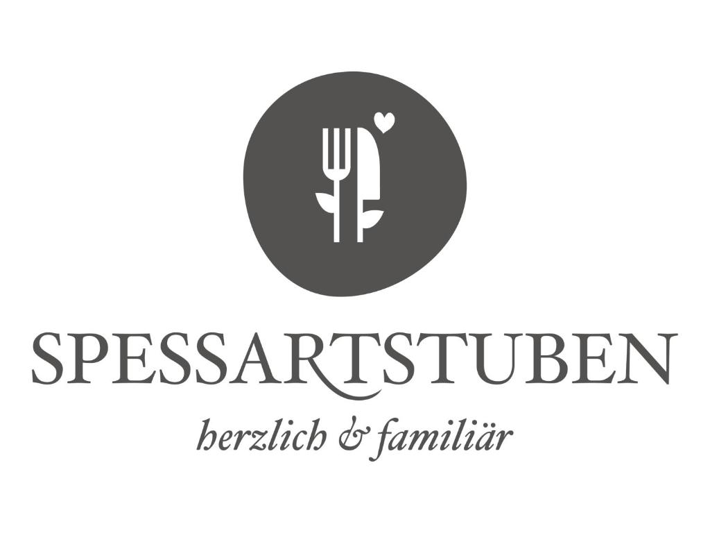 海巴赫Hotel Spessartstuben的带有叉子和刀子的餐厅标志