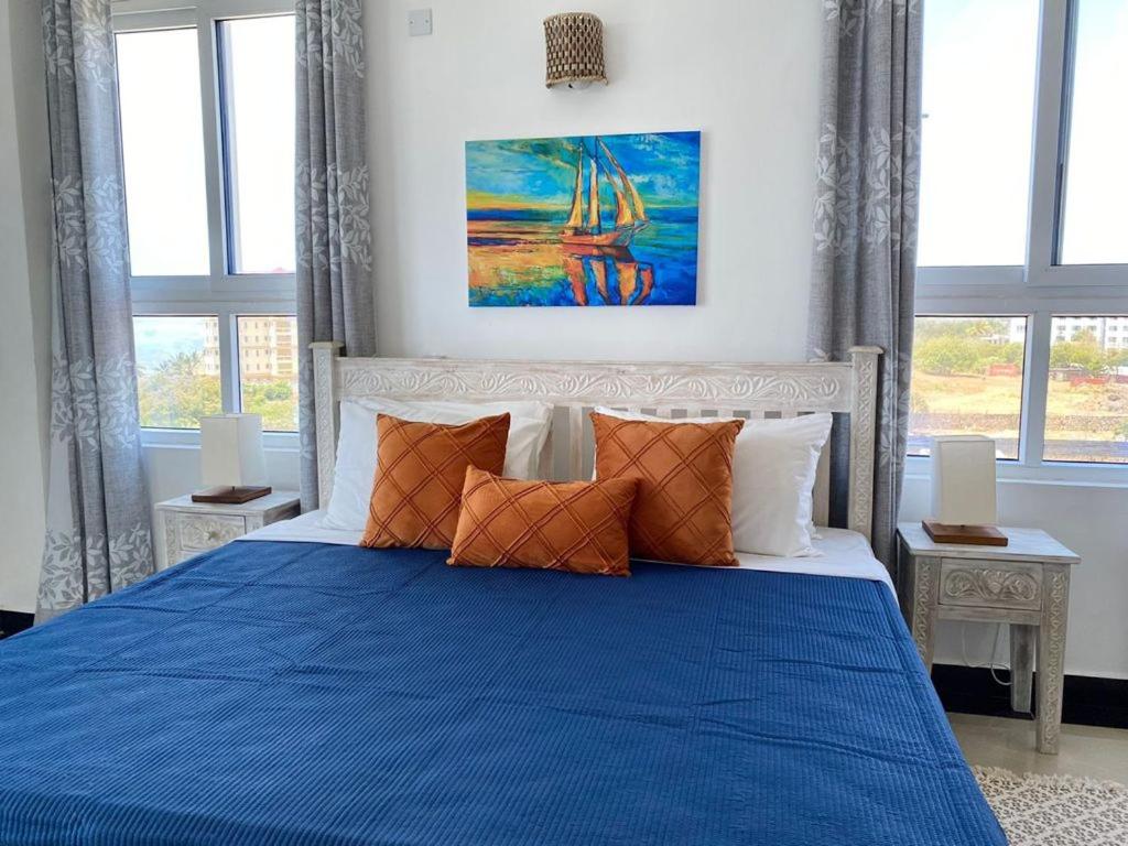Nyali Emirates Reef Apartment客房内的一张或多张床位