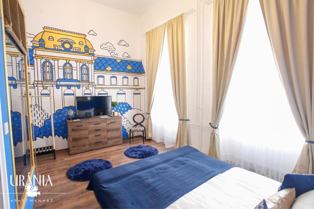 埃格尔Uránia Apartmanház的卧室,墙上挂着建筑壁画