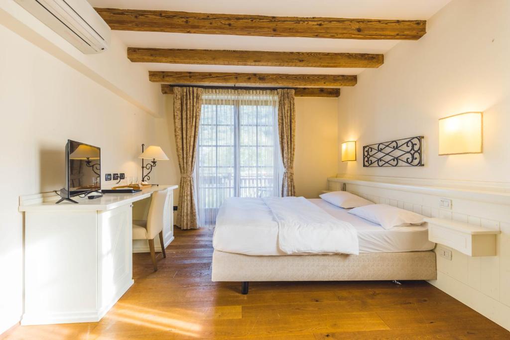 Hotel Relais Vecchio Maso客房内的一张或多张床位