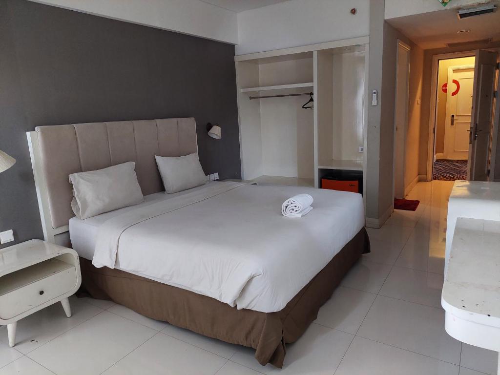 Hotel Grand Malebu客房内的一张或多张床位