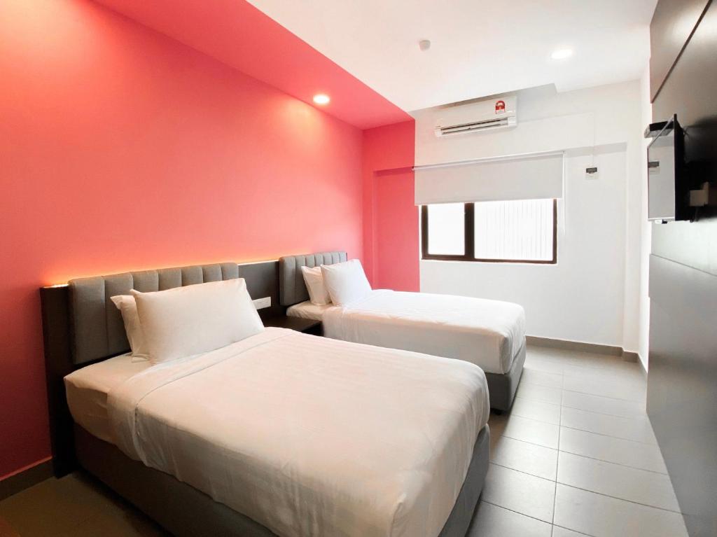 The Concept Hotel Langkawi客房内的一张或多张床位
