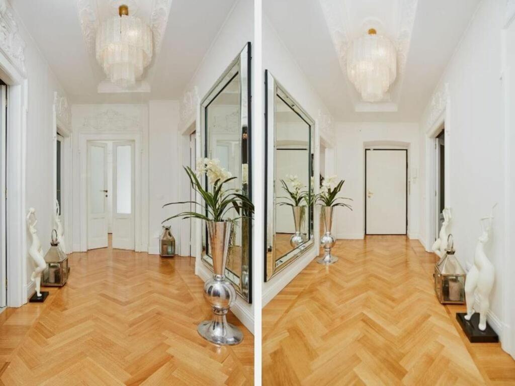 米兰Vallazze Luxury的两幅走廊照片,带镜子和花瓶