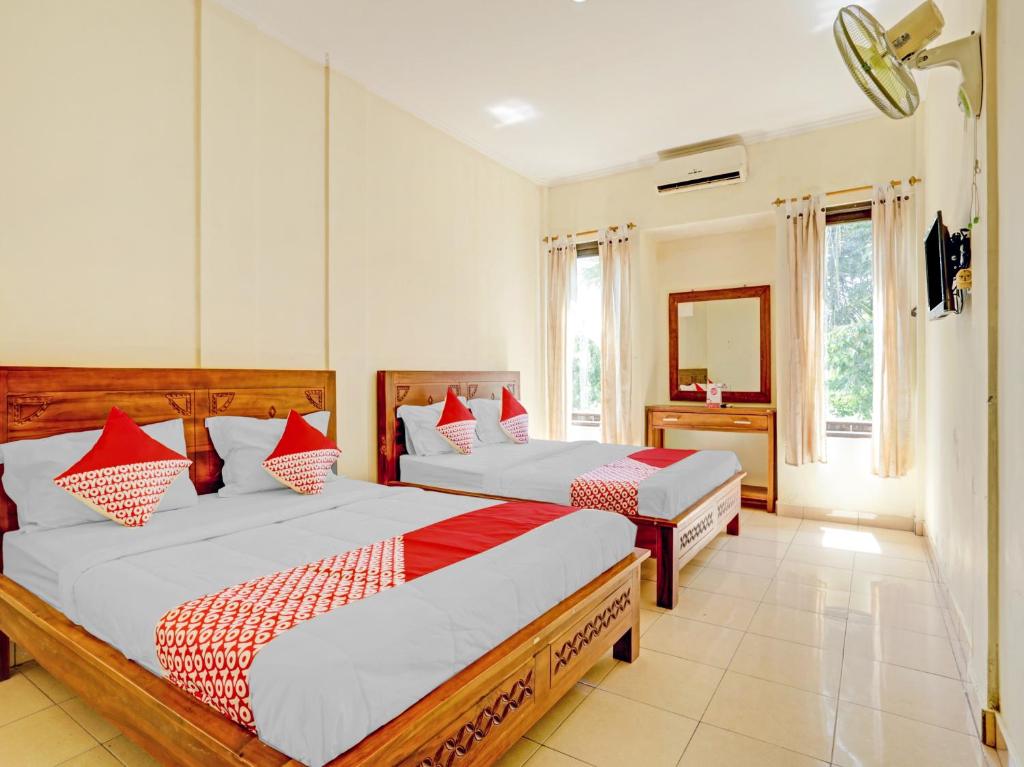 OYO 3062 Pondok Wisata Dewata客房内的一张或多张床位