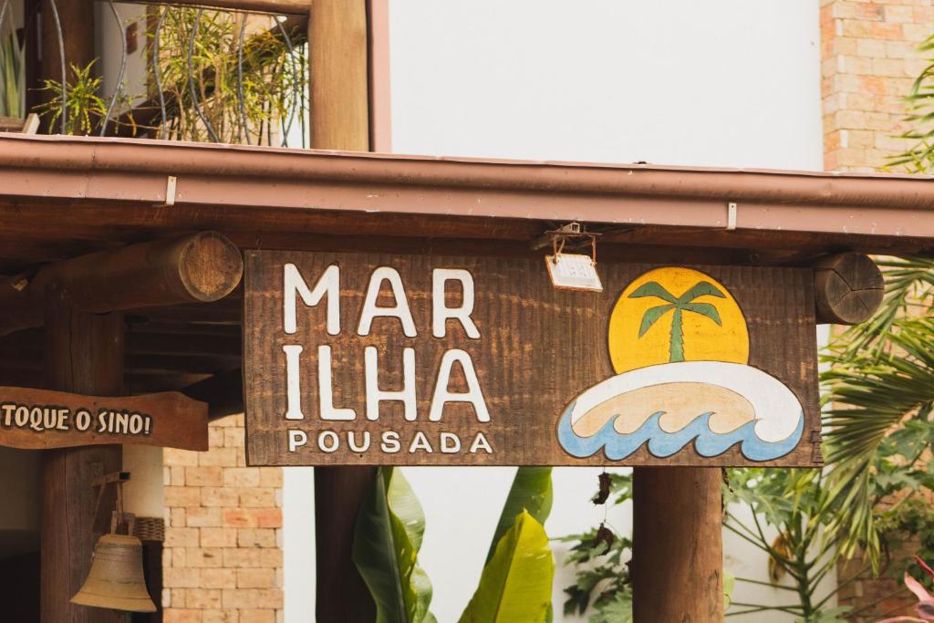 伊塔卡雷Mar Ilha Pousada的建筑里玛利卡餐厅的标志