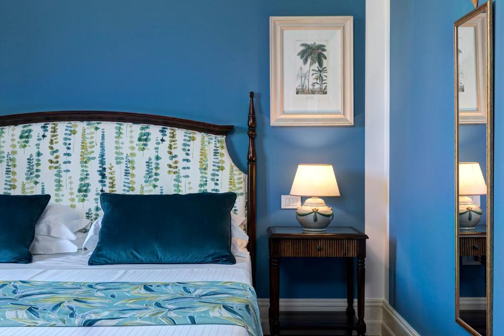 Hotel Baglio Oneto dei Principi di San Lorenzo - Luxury Wine Resort客房内的一张或多张床位