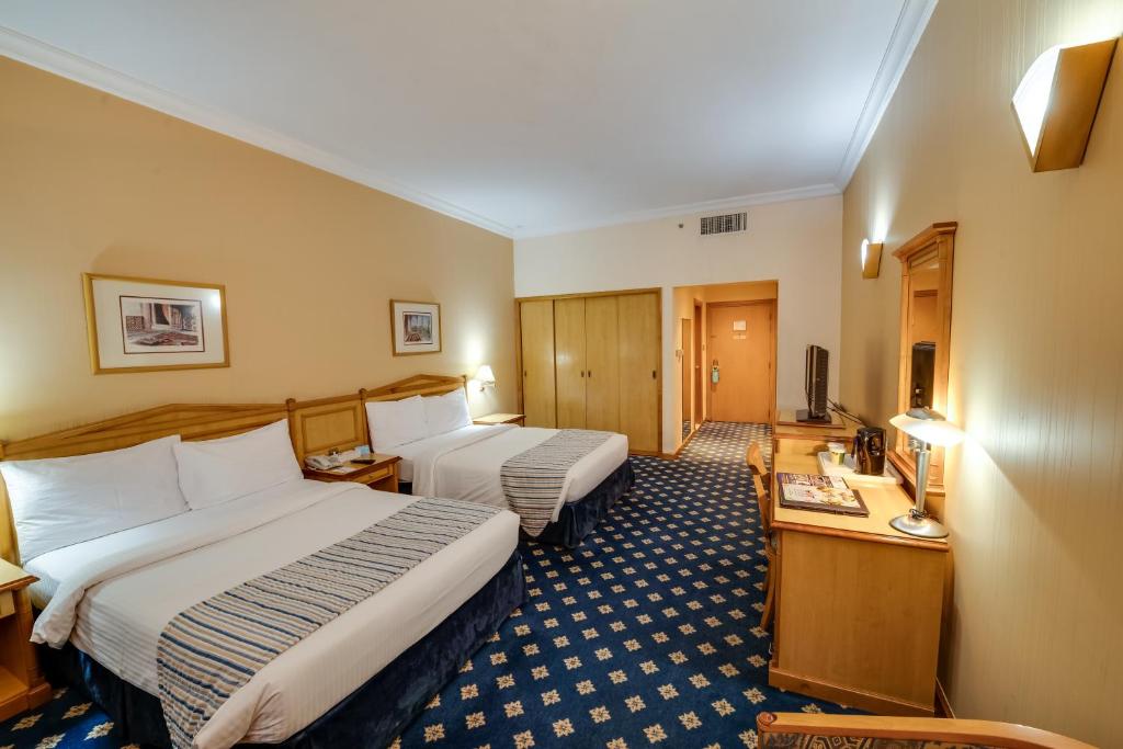 Grand Continental Hotel客房内的一张或多张床位