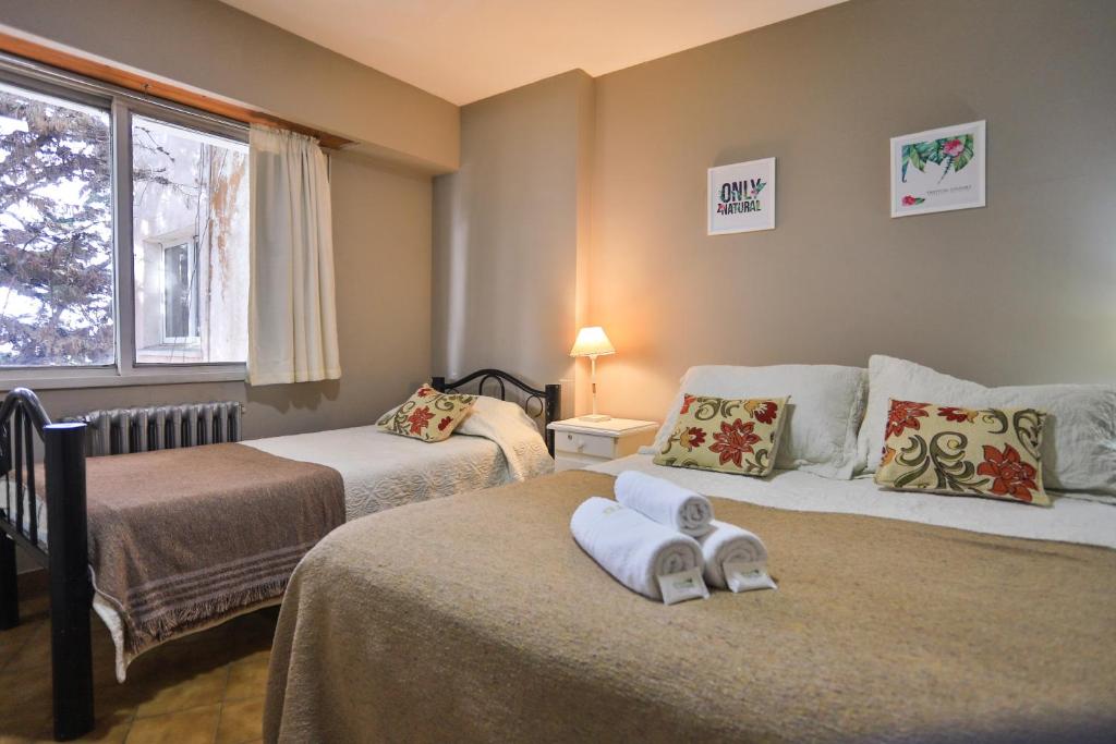 Trip Bariloche Select客房内的一张或多张床位