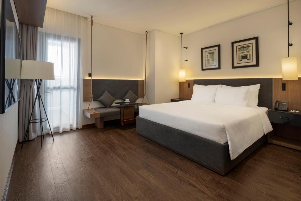 Mandala Hotel & Suites Bac Giang客房内的一张或多张床位