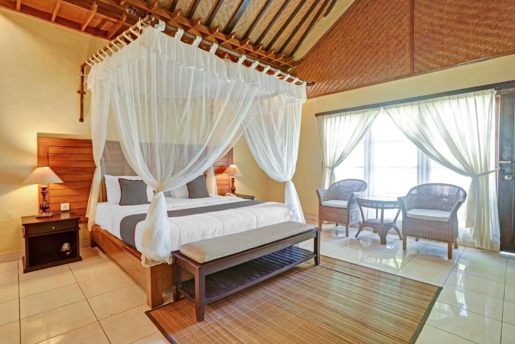 Collection O 90805 Aditya Beach Resort And Spa客房内的一张或多张床位