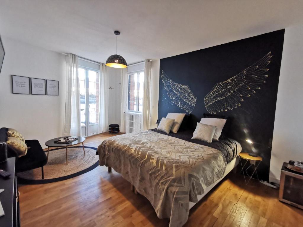 Les Rauches - Quai Loire - Suite Love客房内的一张或多张床位